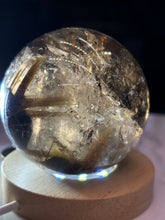 Load image into Gallery viewer, 2.3" Tricolor Rutile Smokey Quartz Sphere 312 grams
